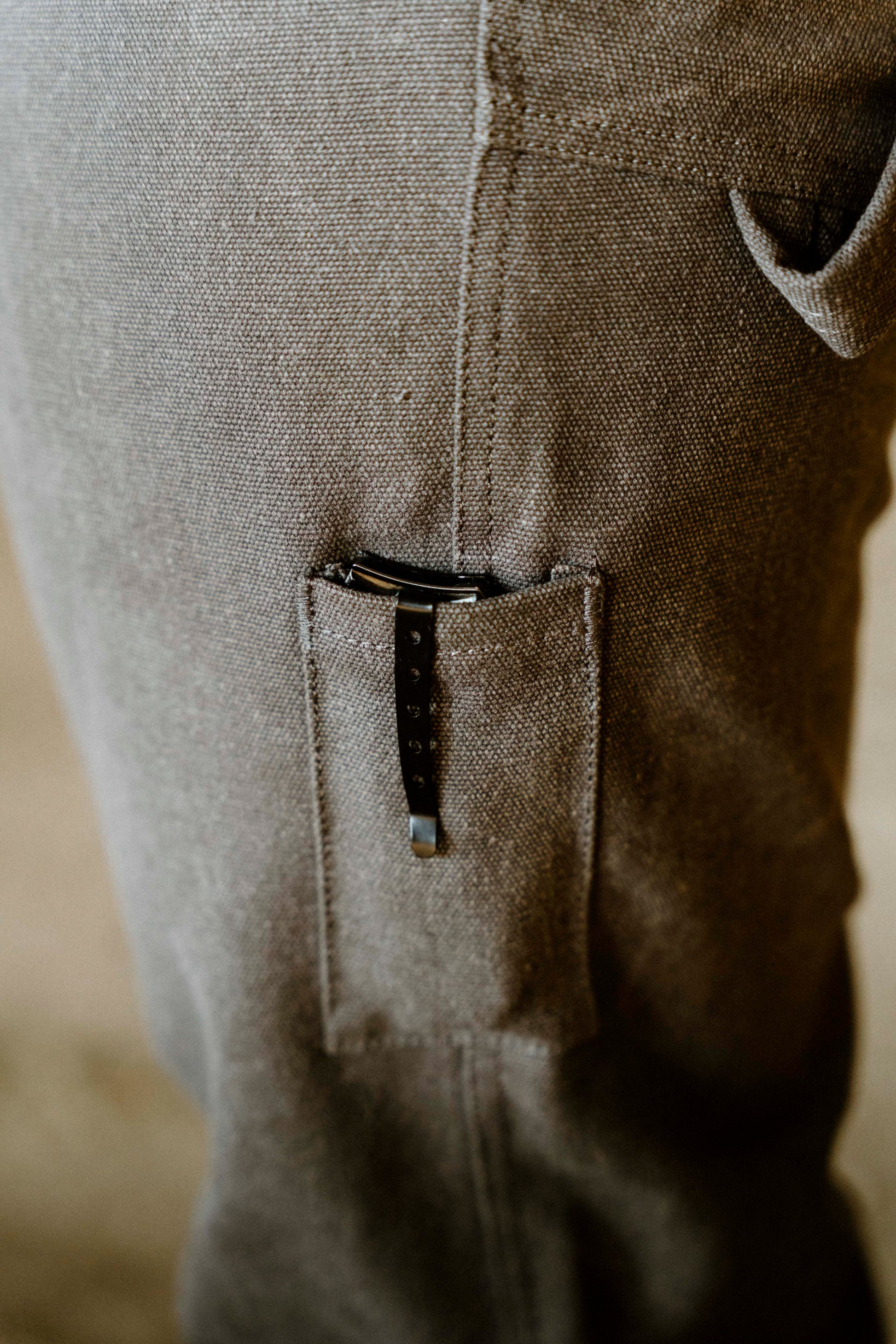 Close-up of a pocket on a textured fabric surface